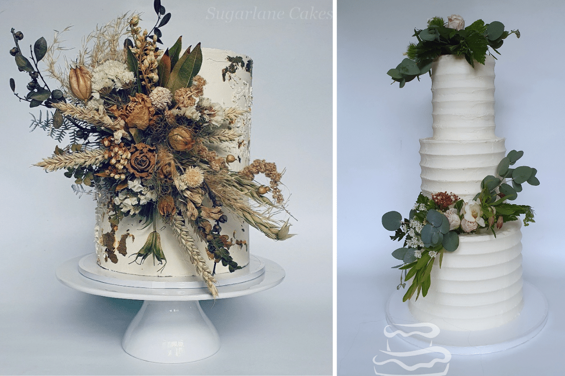 Two tier wedding cake with white buttercream and fresh flowers
